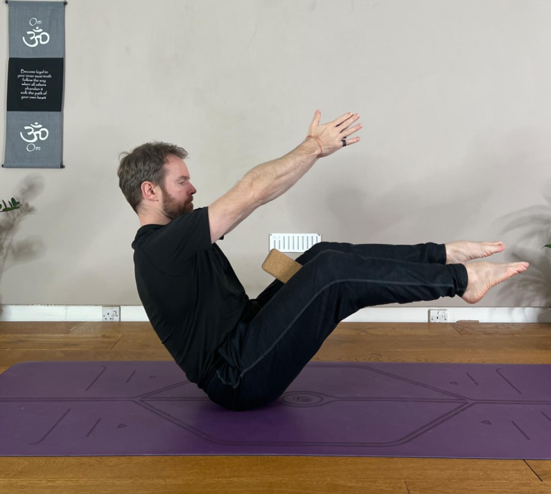 Boat Pose with a Yoga block between Inner Thighs